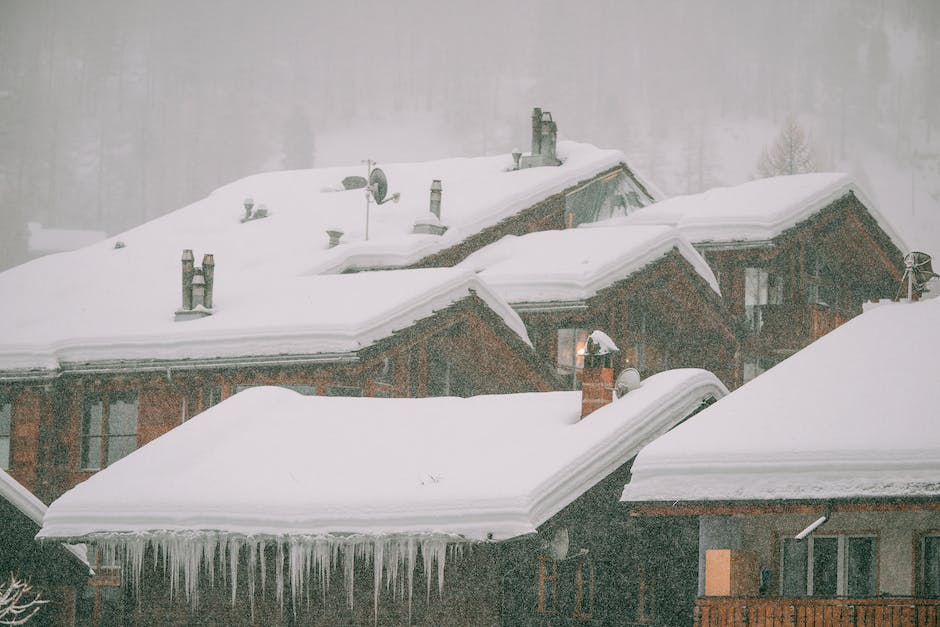 Snow covered roofs can be a danger for damage, leaks and weakness.